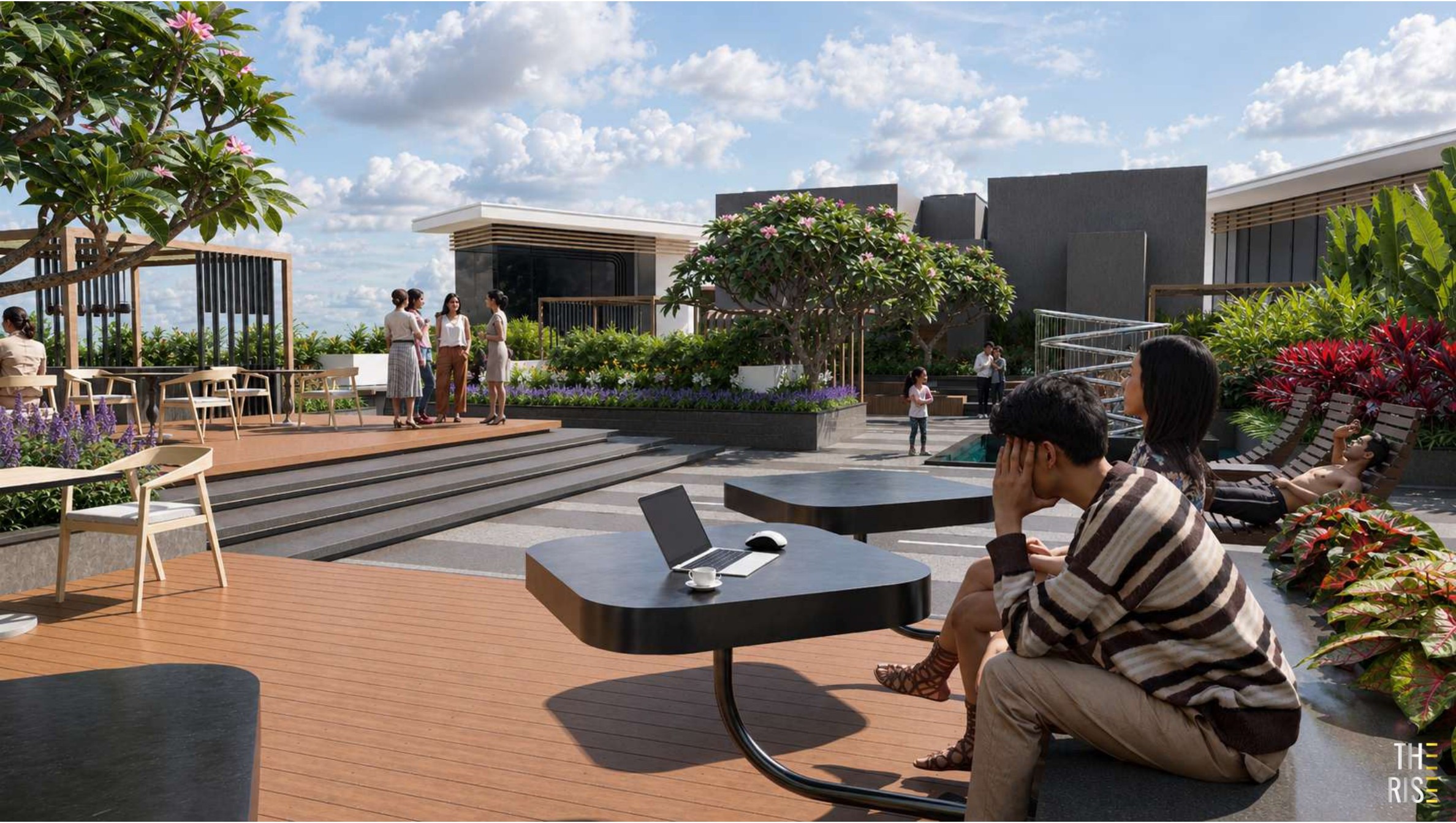 Rooftop deck lounge seating area on the sky bridge level at The Rise